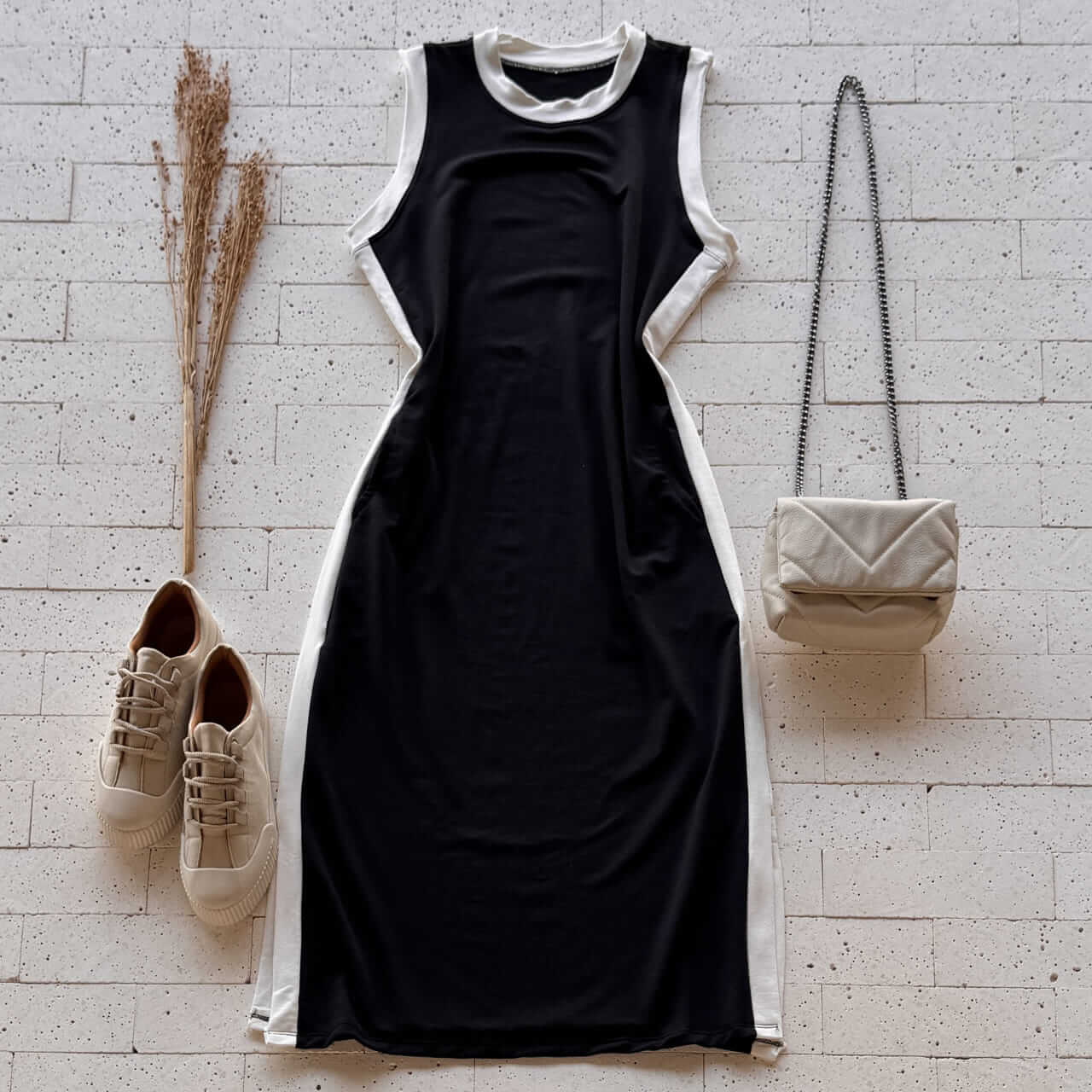https://dondoca.com.br/wp-content/uploads/2026/02/dondoca_com_br-vestido-casual-midi-regata-com-fenda-preto.jpg